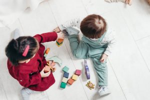Toddlers playing on ground 2 - Pexels